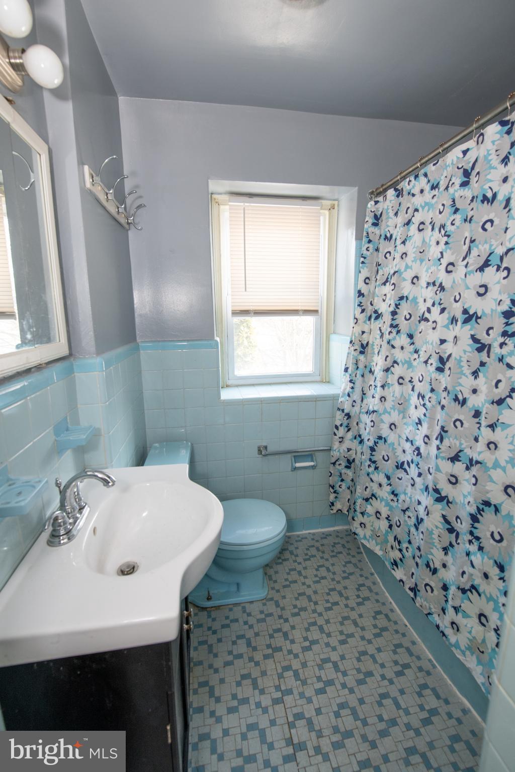 7820 Haines Road Cheltenham, PA 19012 - Photo 31 of 51 a bathroom with a sink a toilet and shower