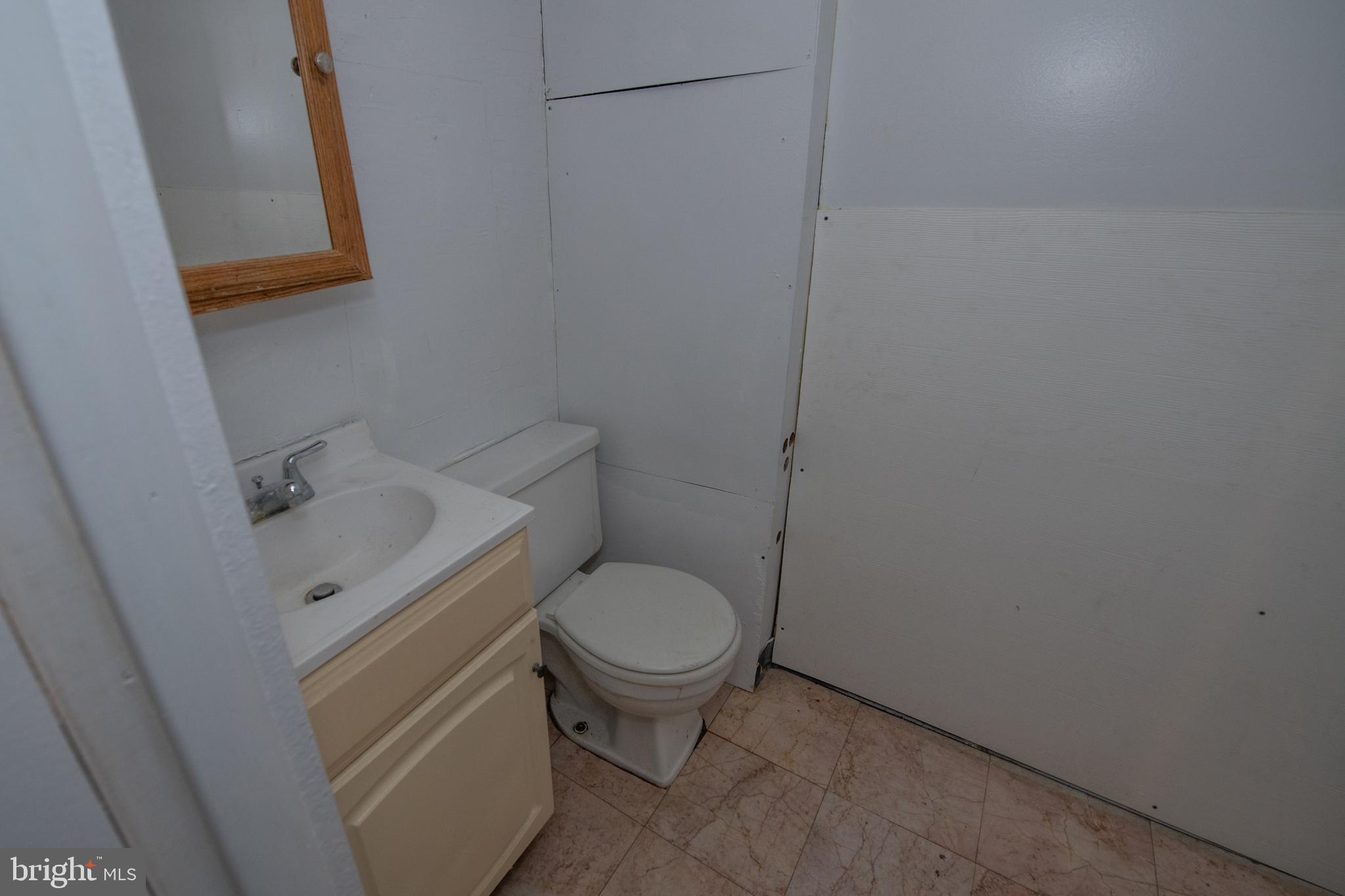 7820 Haines Road Cheltenham, PA 19012 - Photo 38 of 51 a white toilet sitting next to a bathroom sink