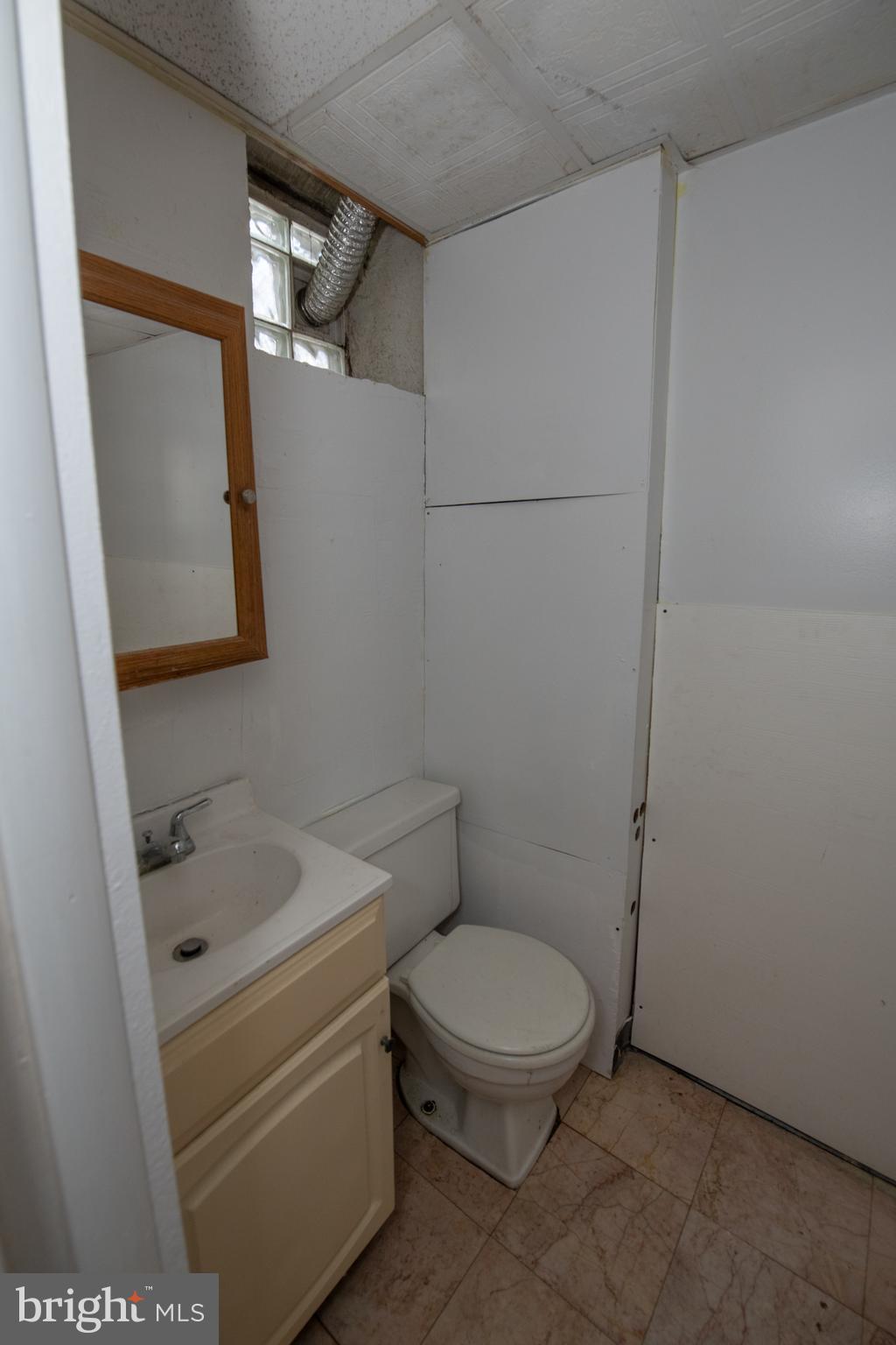 7820 Haines Road Cheltenham, PA 19012 - Photo 39 of 51 a white toilet sitting next to a bathroom sink