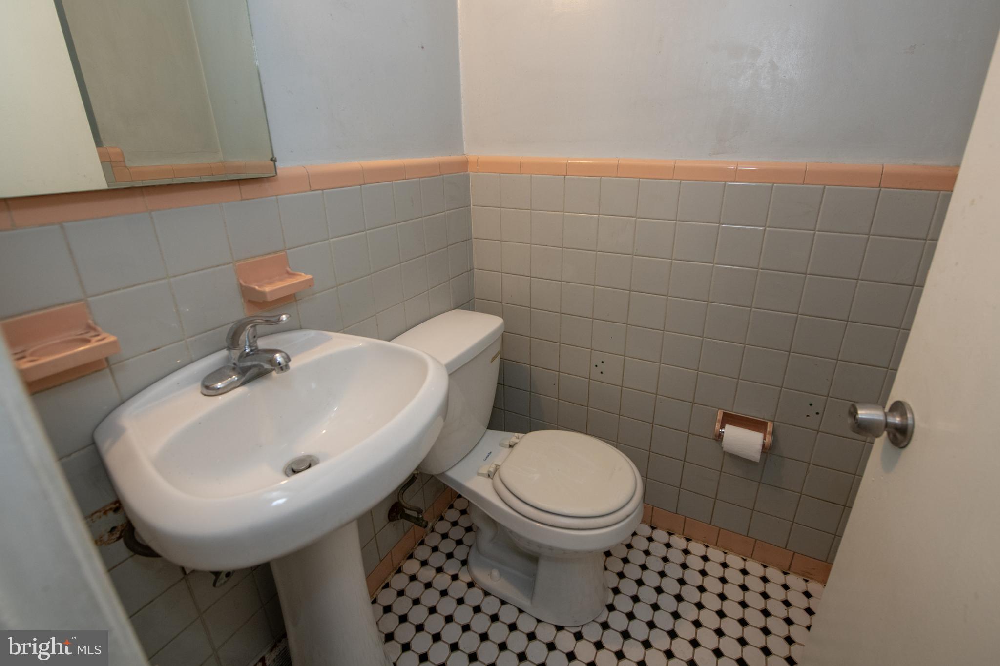 7820 Haines Road Cheltenham, PA 19012 - Photo 5 of 51 a bathroom with a sink toilet and a mirror