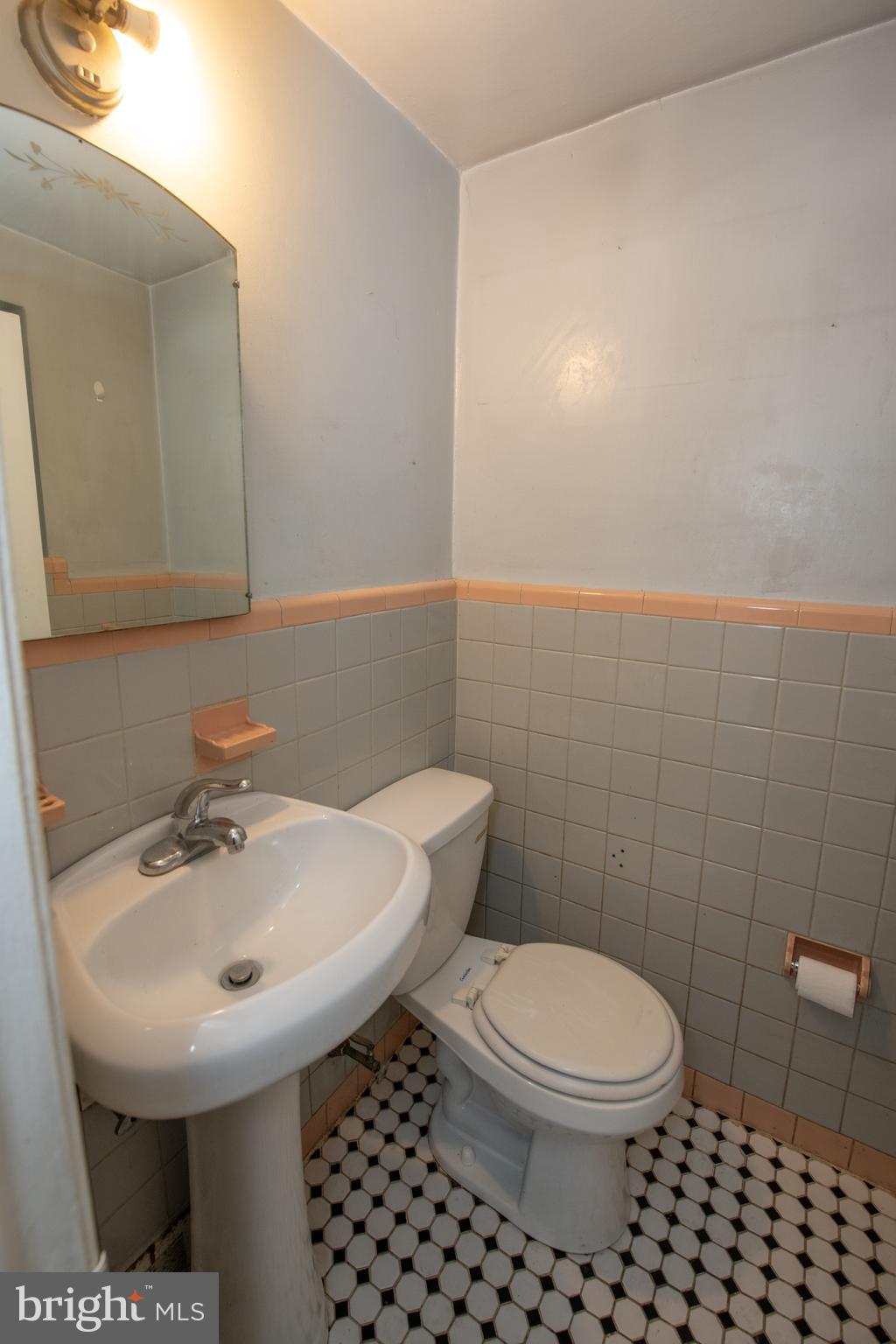 7820 Haines Road Cheltenham, PA 19012 - Photo 6 of 51 a bathroom with a sink a toilet and a mirror