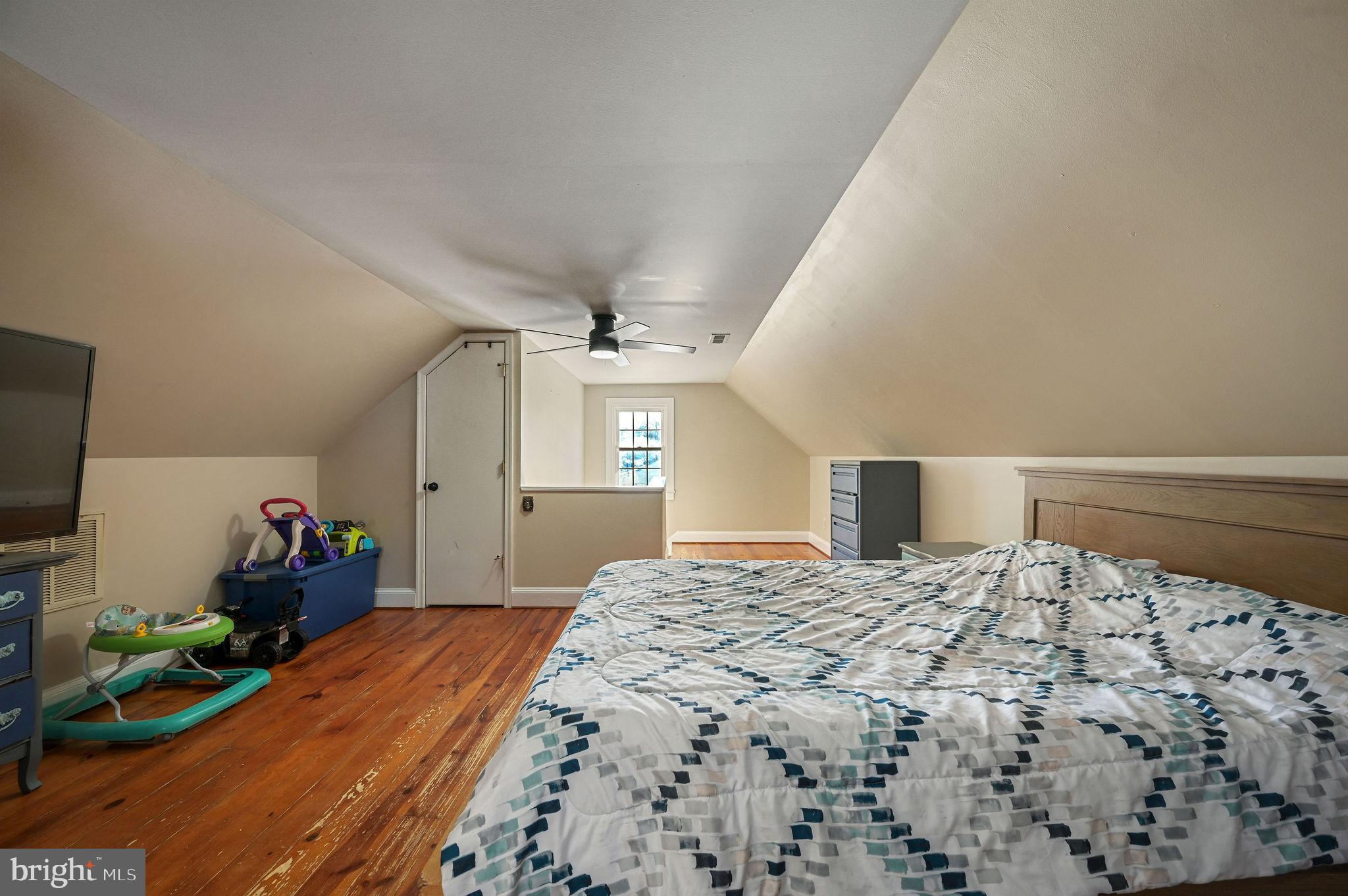 12739 Greensboro Road Greensboro, MD 21639 - Photo 17 of 28 a bedroom with a bed and a flat screen tv