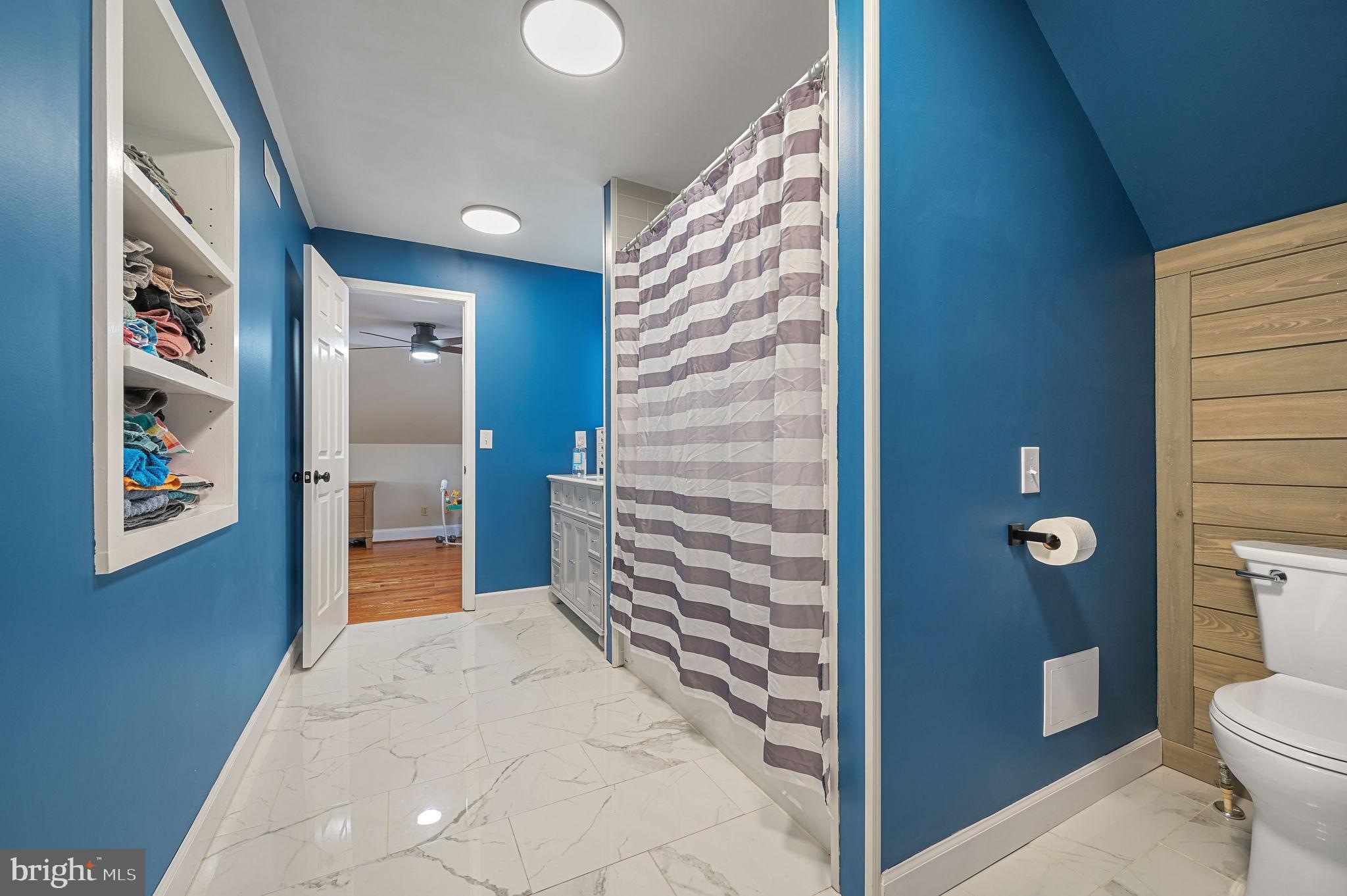 12739 Greensboro Road Greensboro, MD 21639 - Photo 20 of 28 a bathroom with a toilet and a shower