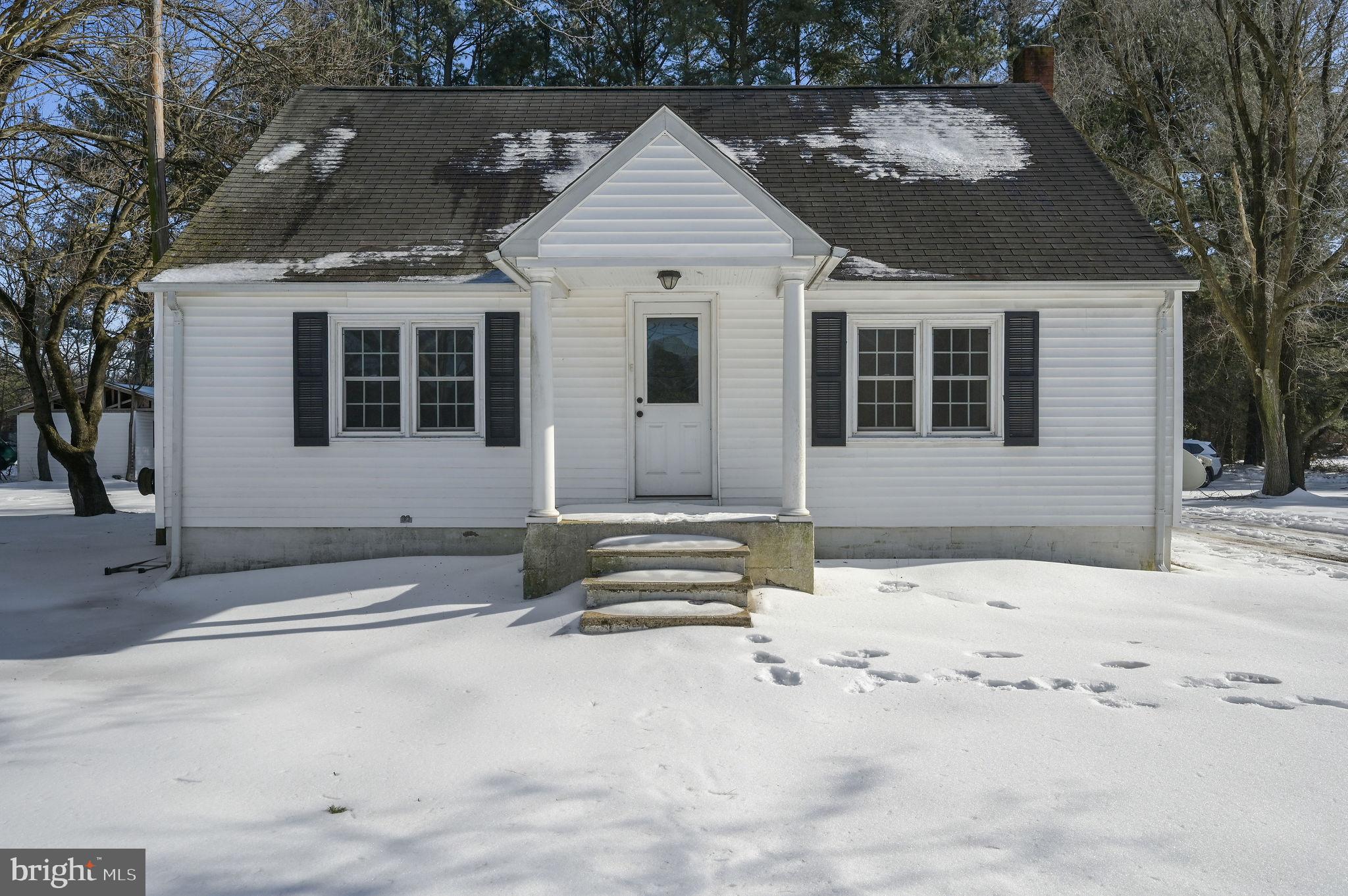 12739 Greensboro Road Greensboro, MD 21639 - Photo 2 of 28 a front view of a house with a yard