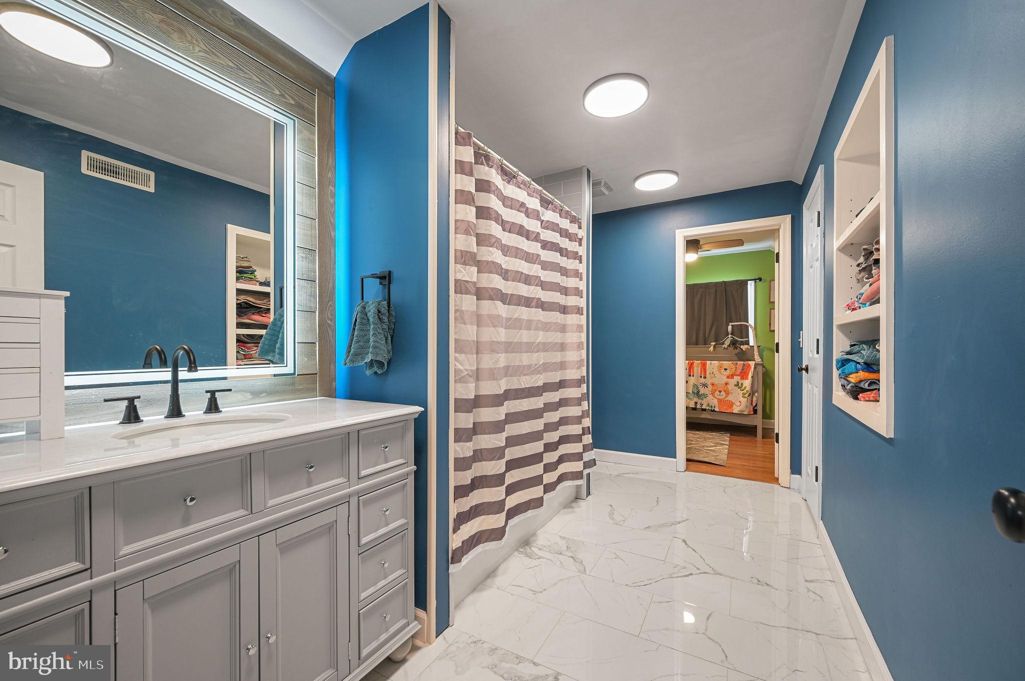 12739 Greensboro Road Greensboro, MD 21639 - Photo 21 of 28 a bathroom with a sink and a mirror
