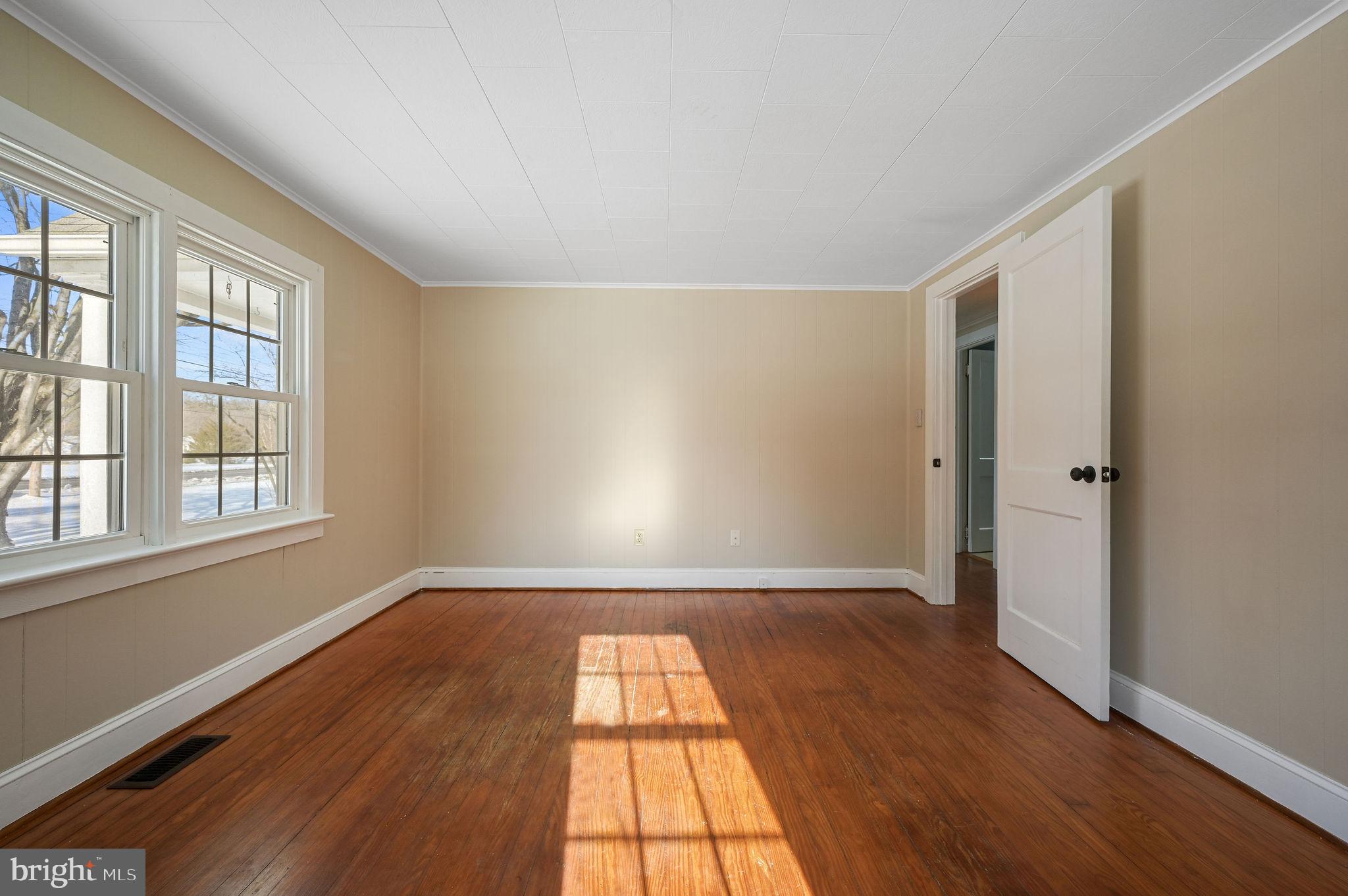 12739 Greensboro Road Greensboro, MD 21639 - Photo 27 of 28 wooden floor in an empty room with a window