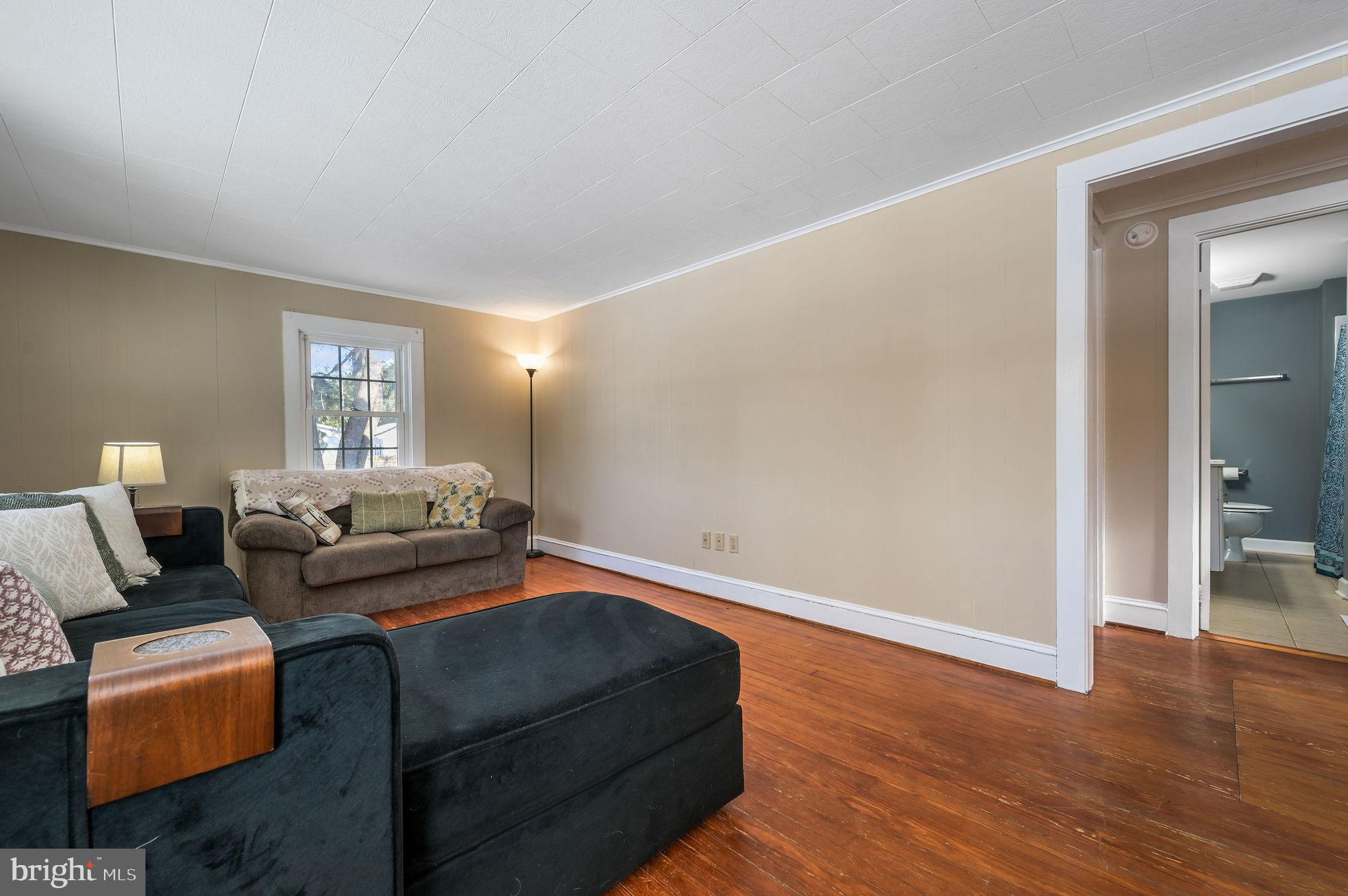 12739 Greensboro Road Greensboro, MD 21639 - Photo 5 of 28 a living room with furniture and wooden floor