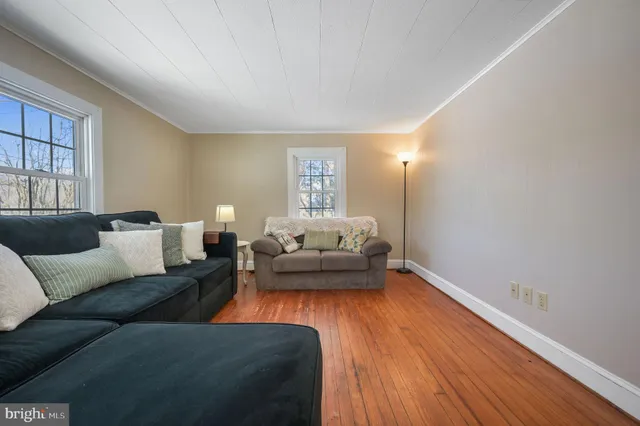 a bedroom with furniture and a flat screen tv
