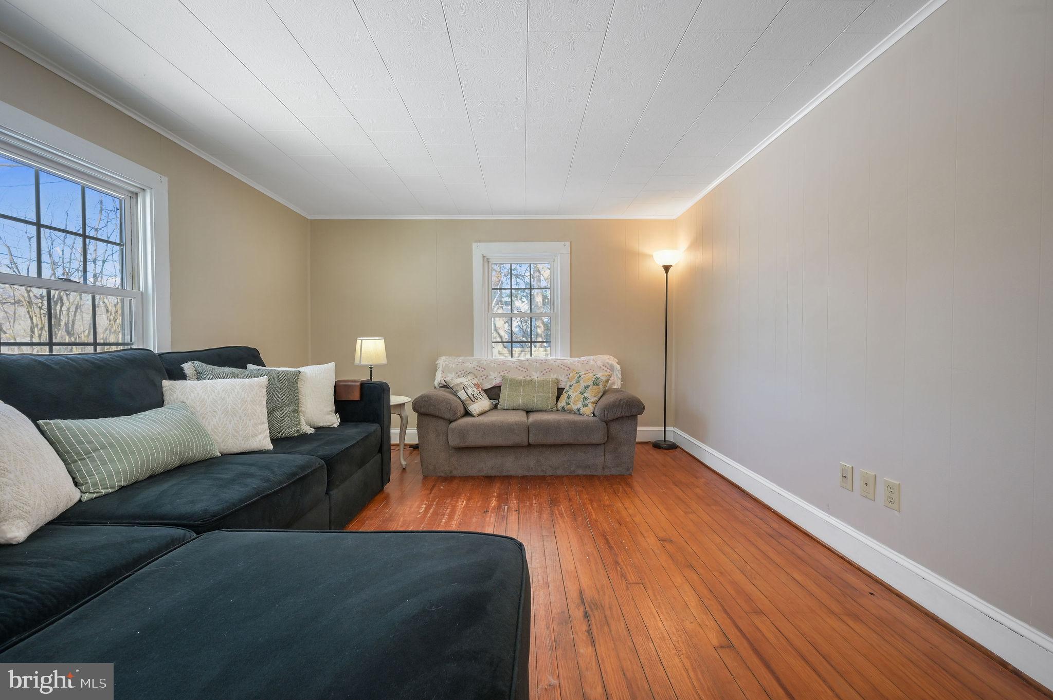 12739 Greensboro Road Greensboro, MD 21639 - Photo 6 of 28 a living room with furniture and a hard wood floor