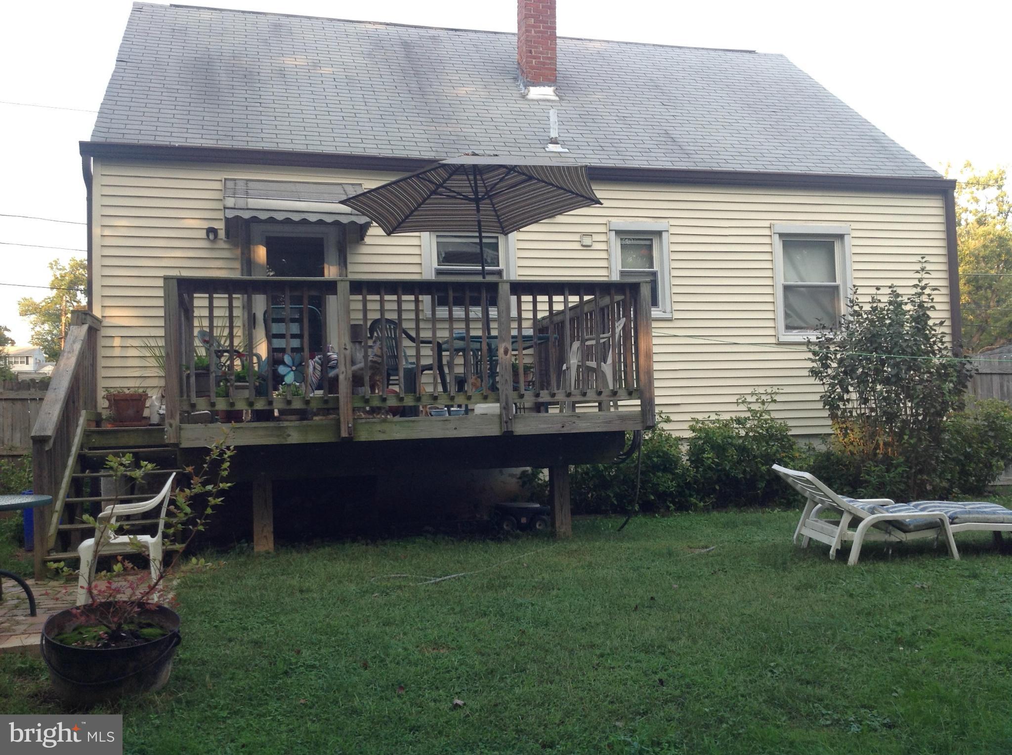 2702 Weisman Road Silver Spring, MD 20902 - Photo 8 of 11 a table and chairs in front of a house