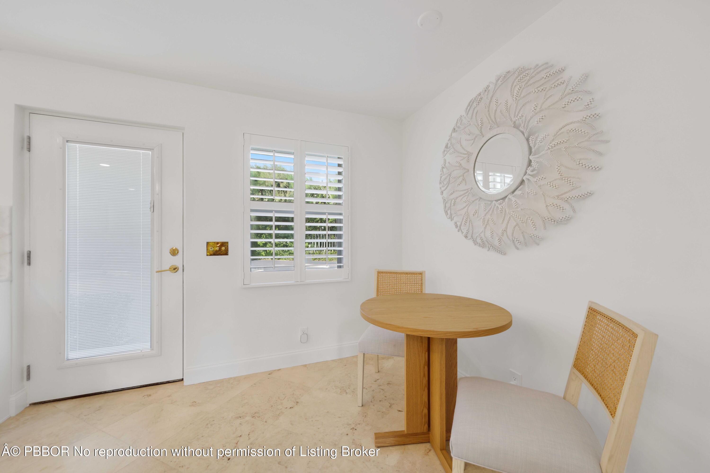 Undisclosed Address Palm Beach, FL 33480 - Photo 15 of 43 a bathroom with a sink a mirror and a window
