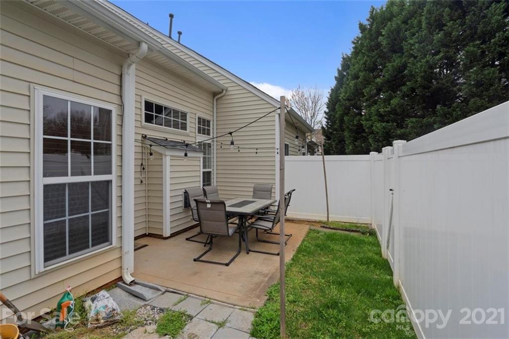 116 Snead Road, Unit 51 Fort Mill, SC 29715 - Photo 29 of 30 a backyard of a house with table and chairs