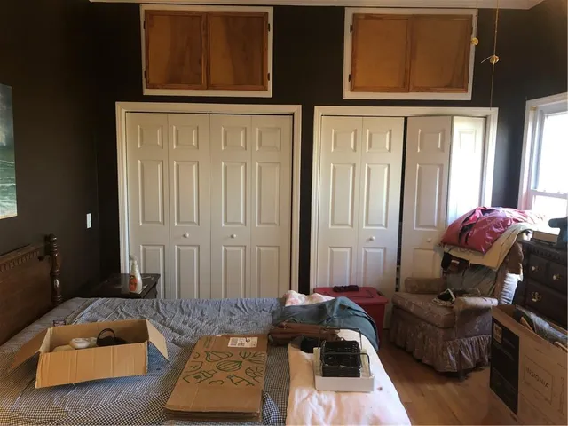 a kitchen with a refrigerator and a stove