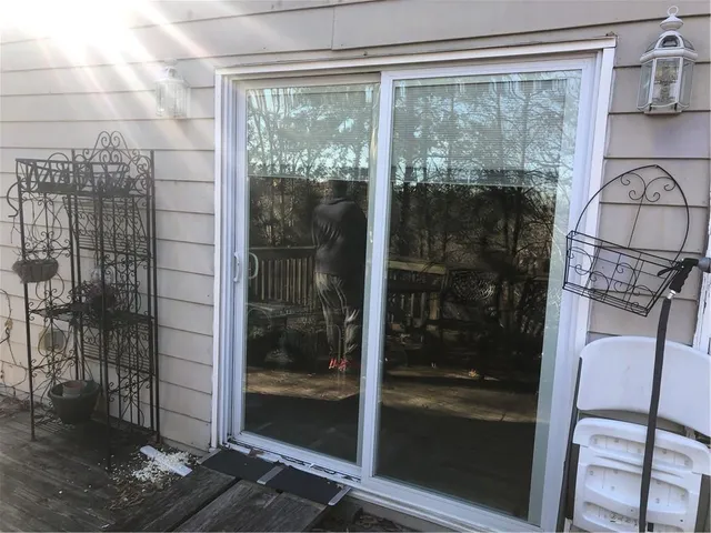 a view of porch with a swing