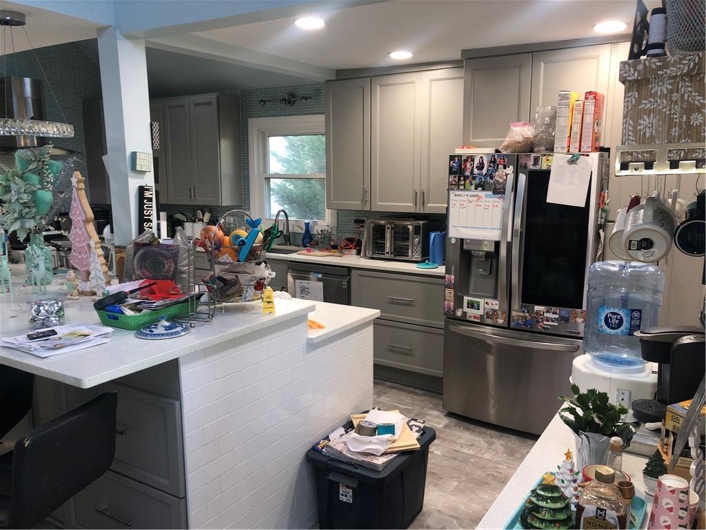 4532 High Rock Terrace Marietta, GA 30066 - Photo 4 of 40 a kitchen filled with a stove and a refrigerator