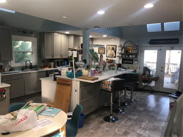 a kitchen with a sink and cabinets