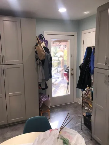 a room with lots of furniture and clutter