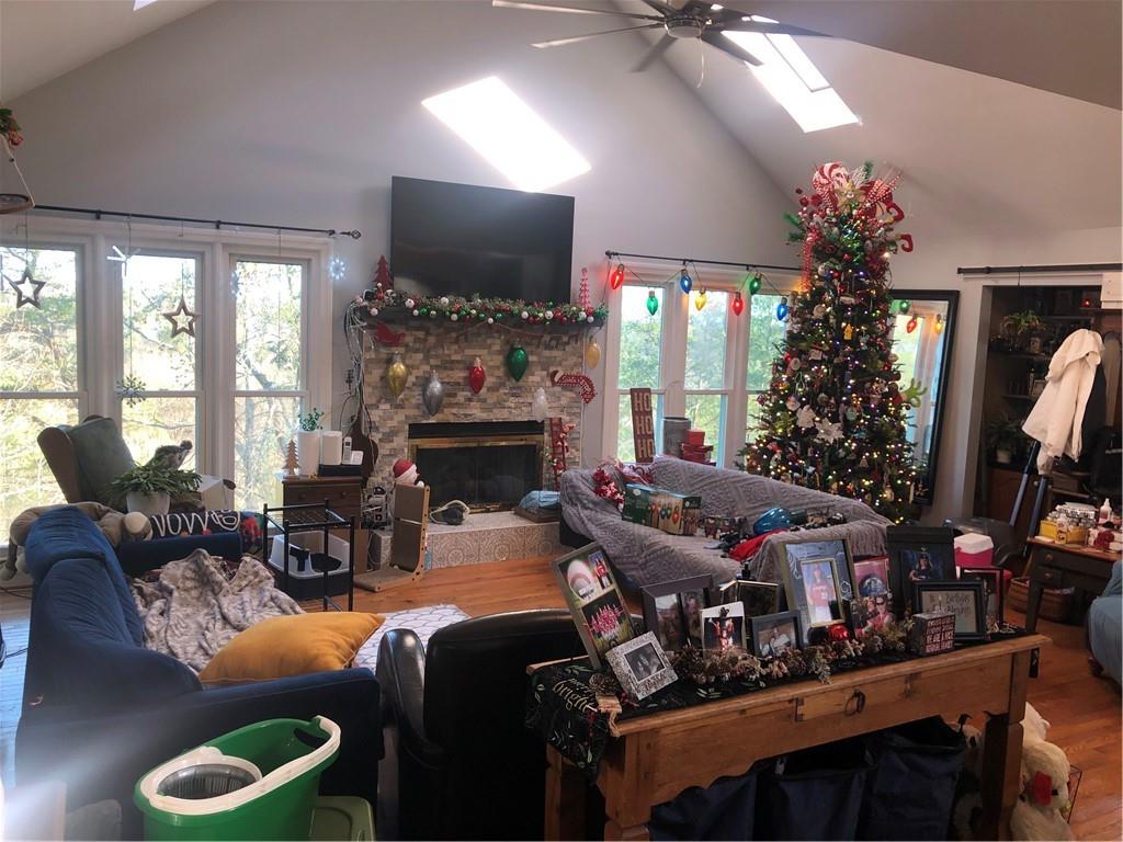4532 High Rock Terrace Marietta, GA 30066 - Photo 10 of 40 a living room with furniture a flat screen tv and a fireplace