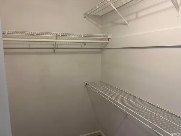 a view of a room with racks on the wall