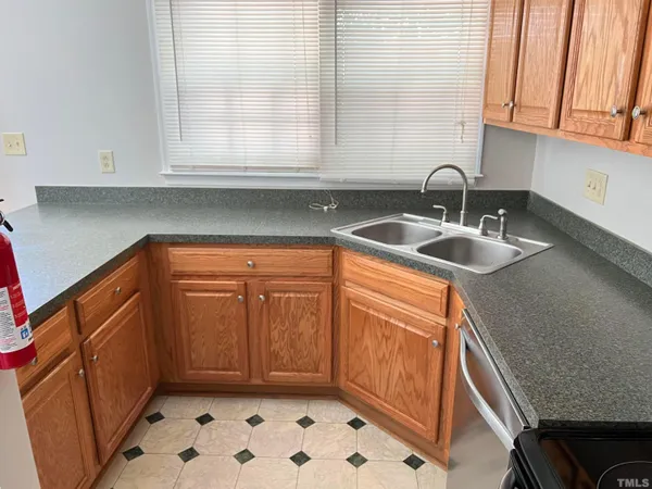 a kitchen with a sink and cabinets