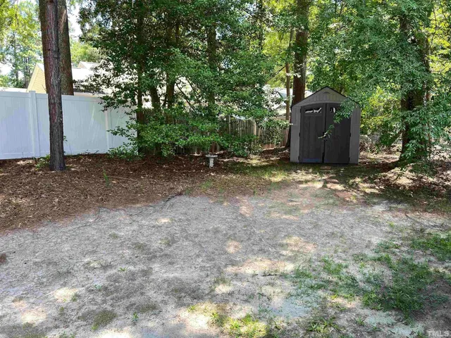 a backyard of a house with lots of green space