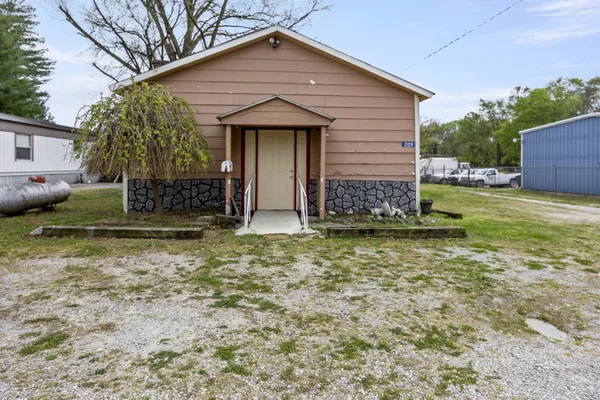 a front view of a house with garden