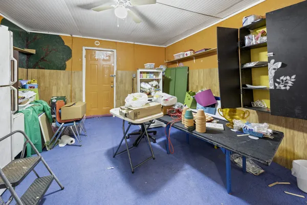 a view of a workspace with furniture