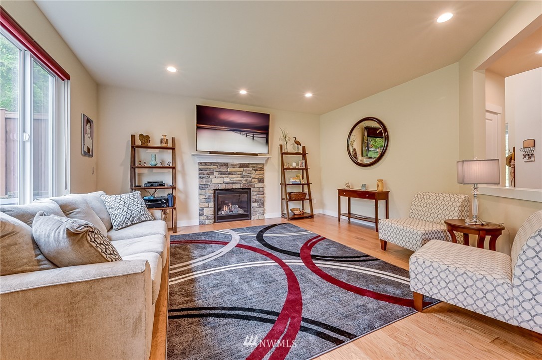 18924 10th Drive Southeast Bothell, WA 98012 - Photo 4 of 28 a living room with furniture a clock and a window