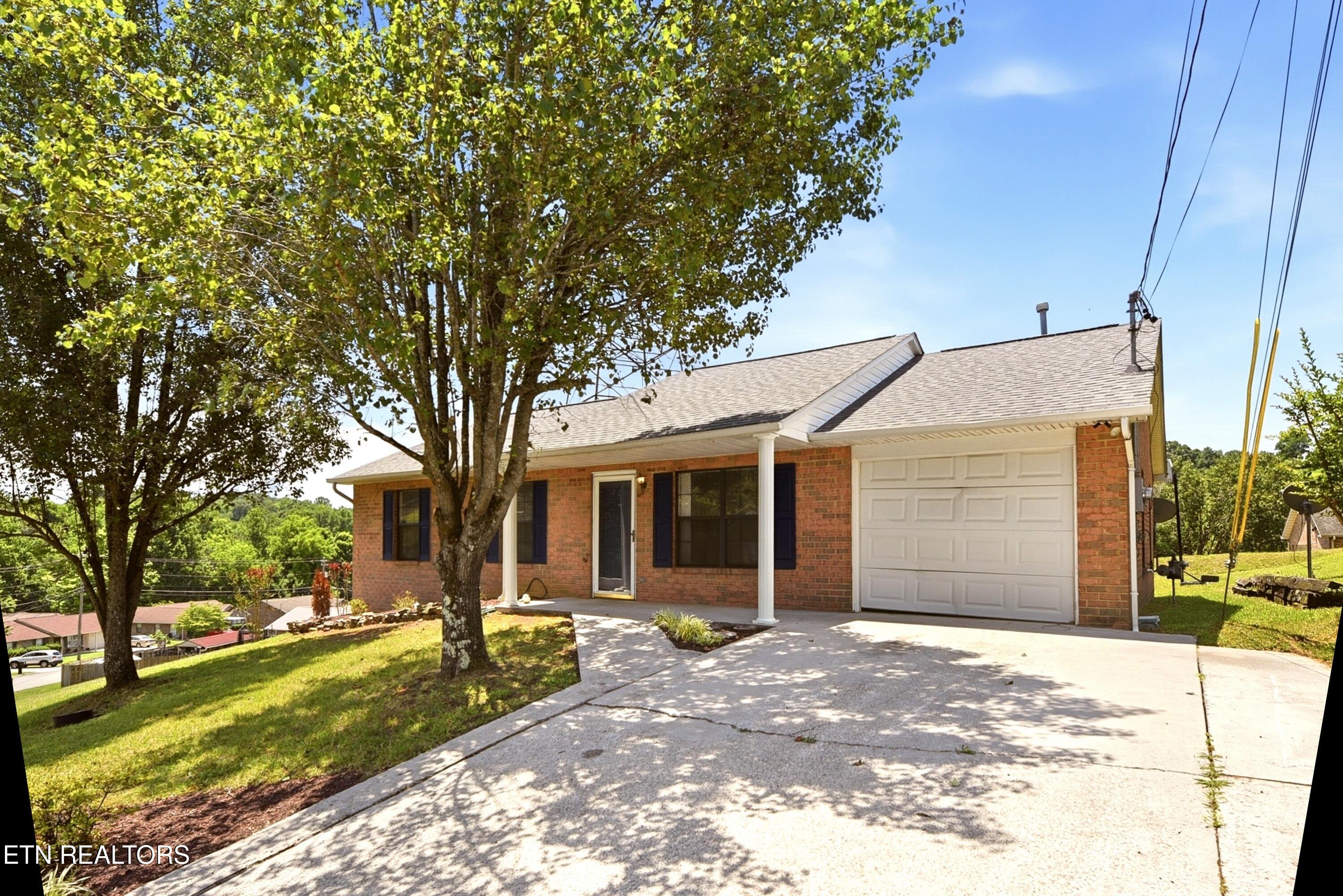 8039 Florence Gardens Road Knoxville, TN 37938 - Photo 2 of 28 1-car garage