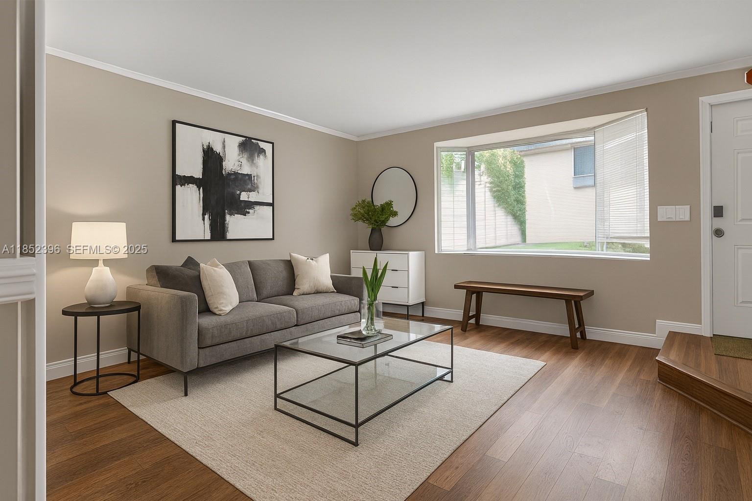 10194 Southwest 77th Court Miami, FL 33156 - Photo 1 of 25 a living room with furniture a lamp paintings and a window