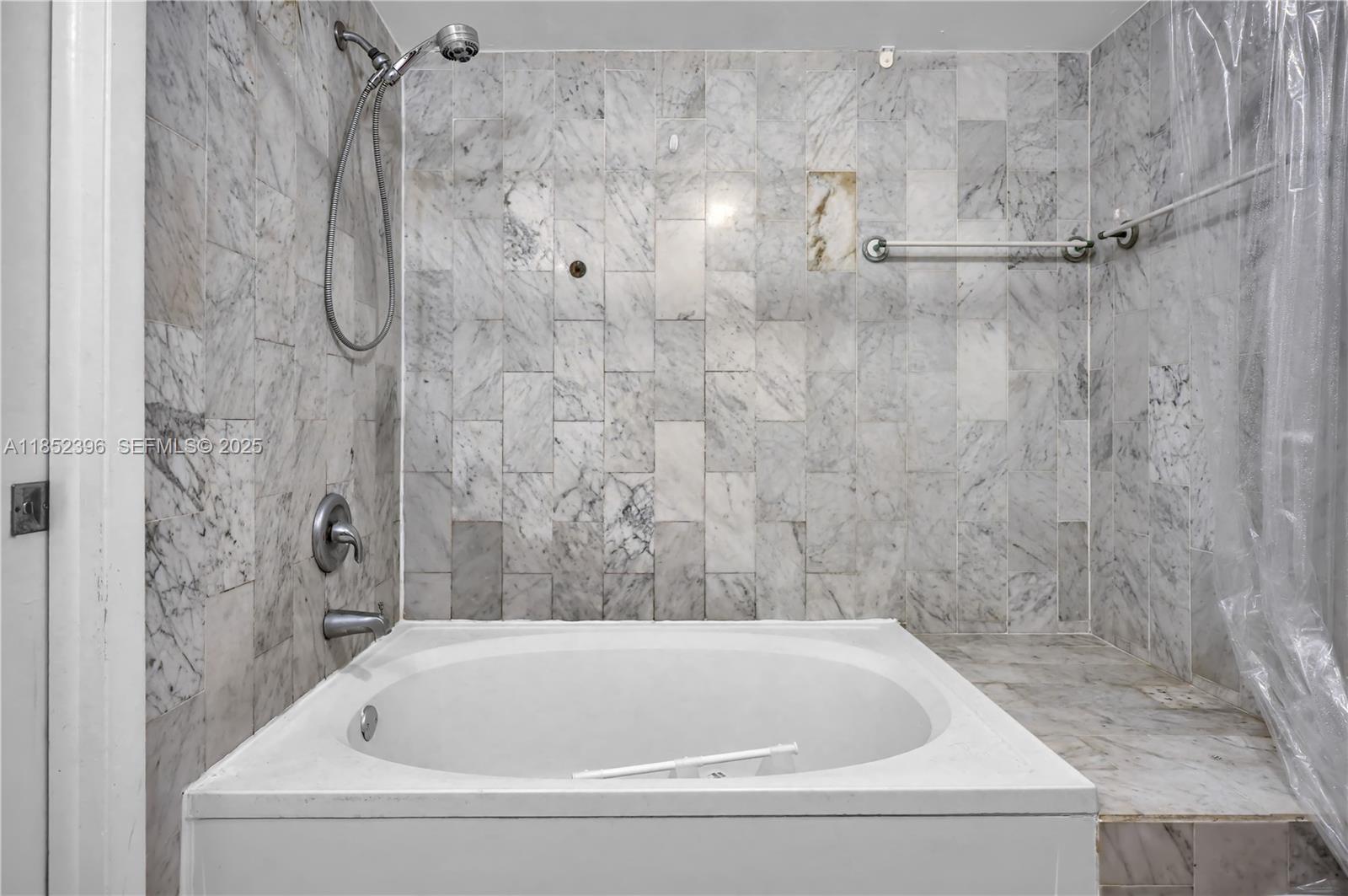 10194 Southwest 77th Court Miami, FL 33156 - Photo 13 of 25 a white bath tub sitting next to a shower