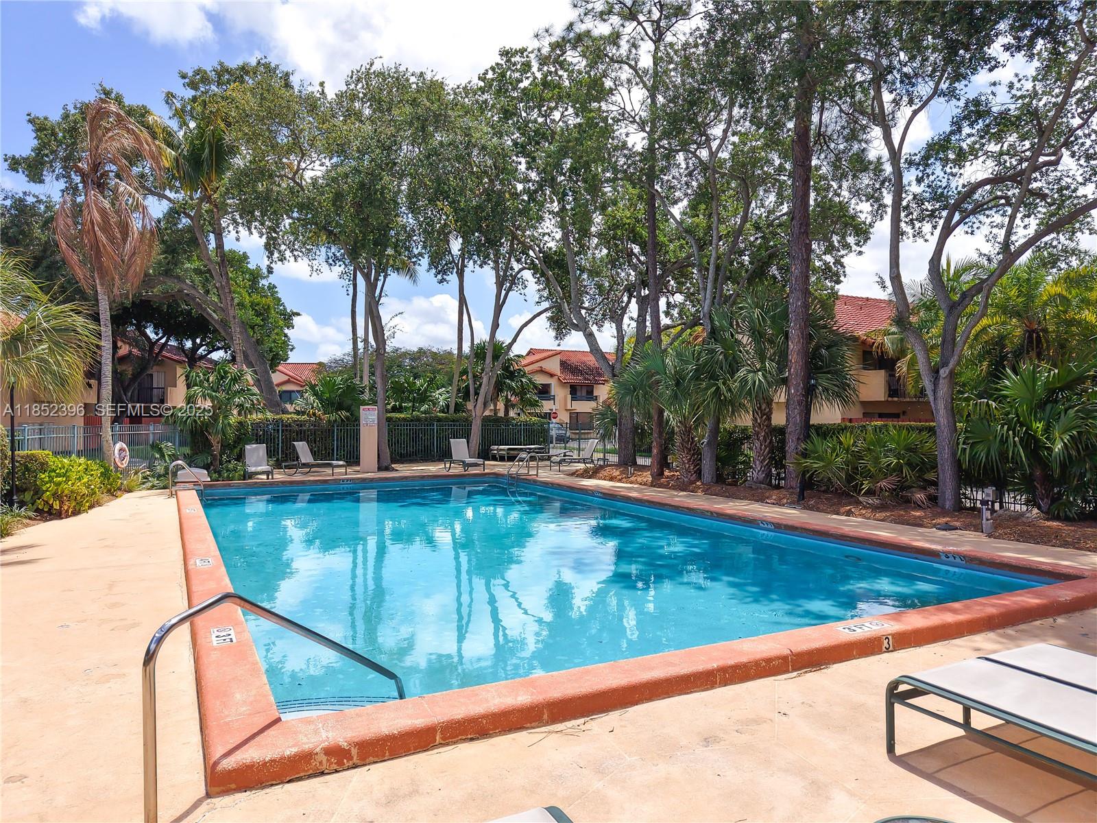 10194 Southwest 77th Court Miami, FL 33156 - Photo 18 of 25 a view of swimming pool with chairs