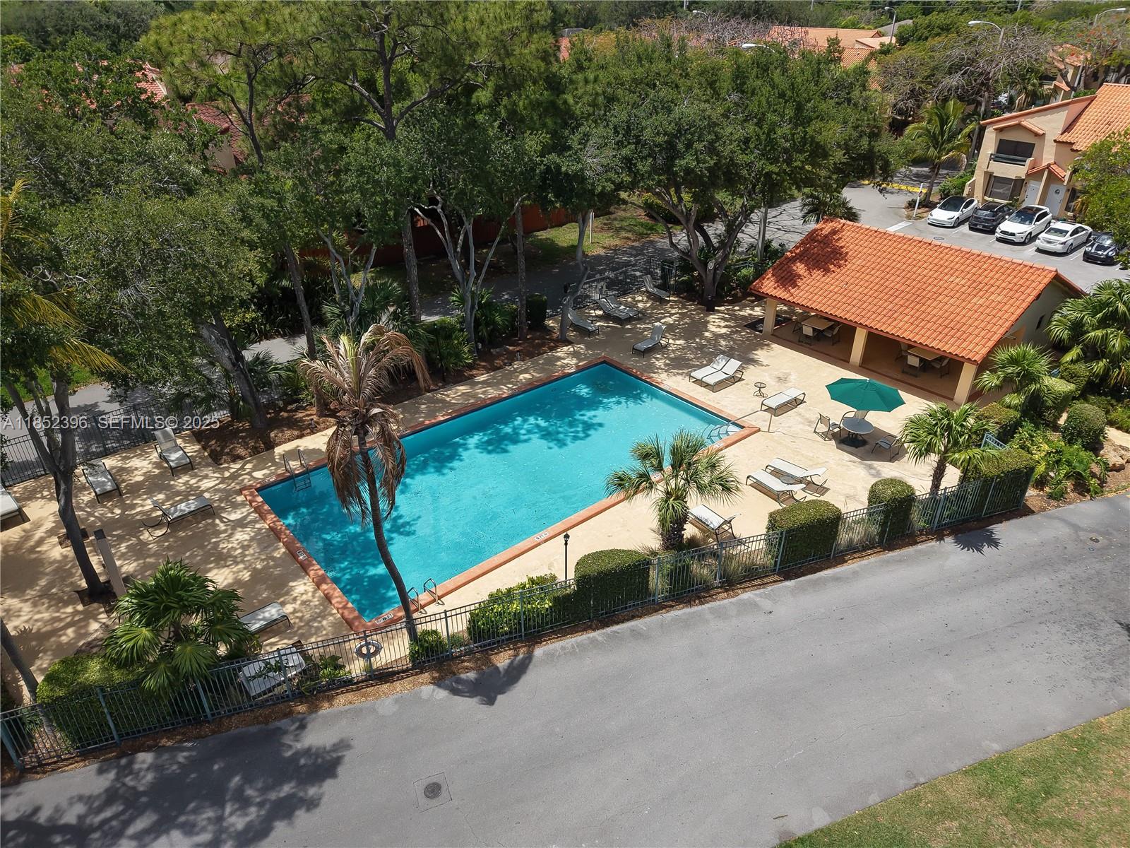 10194 Southwest 77th Court Miami, FL 33156 - Photo 19 of 25 an aerial view of a house with a yard and lake view