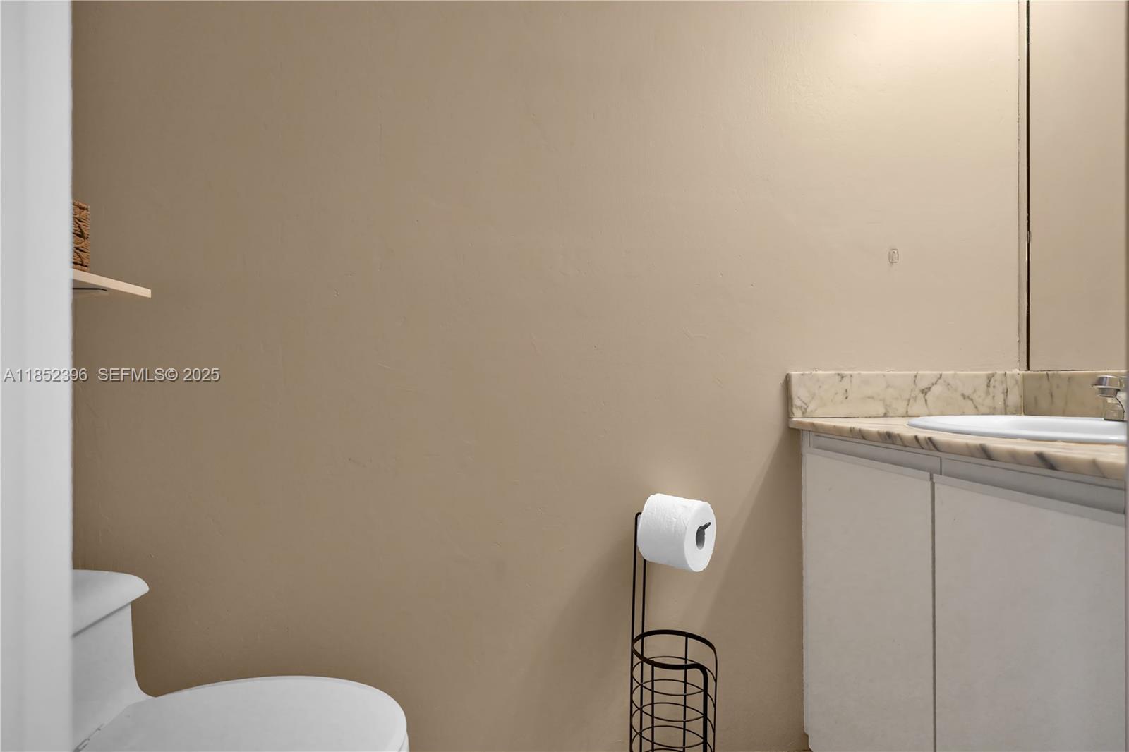 10194 Southwest 77th Court Miami, FL 33156 - Photo 7 of 25 a bathroom with a sink and mirror