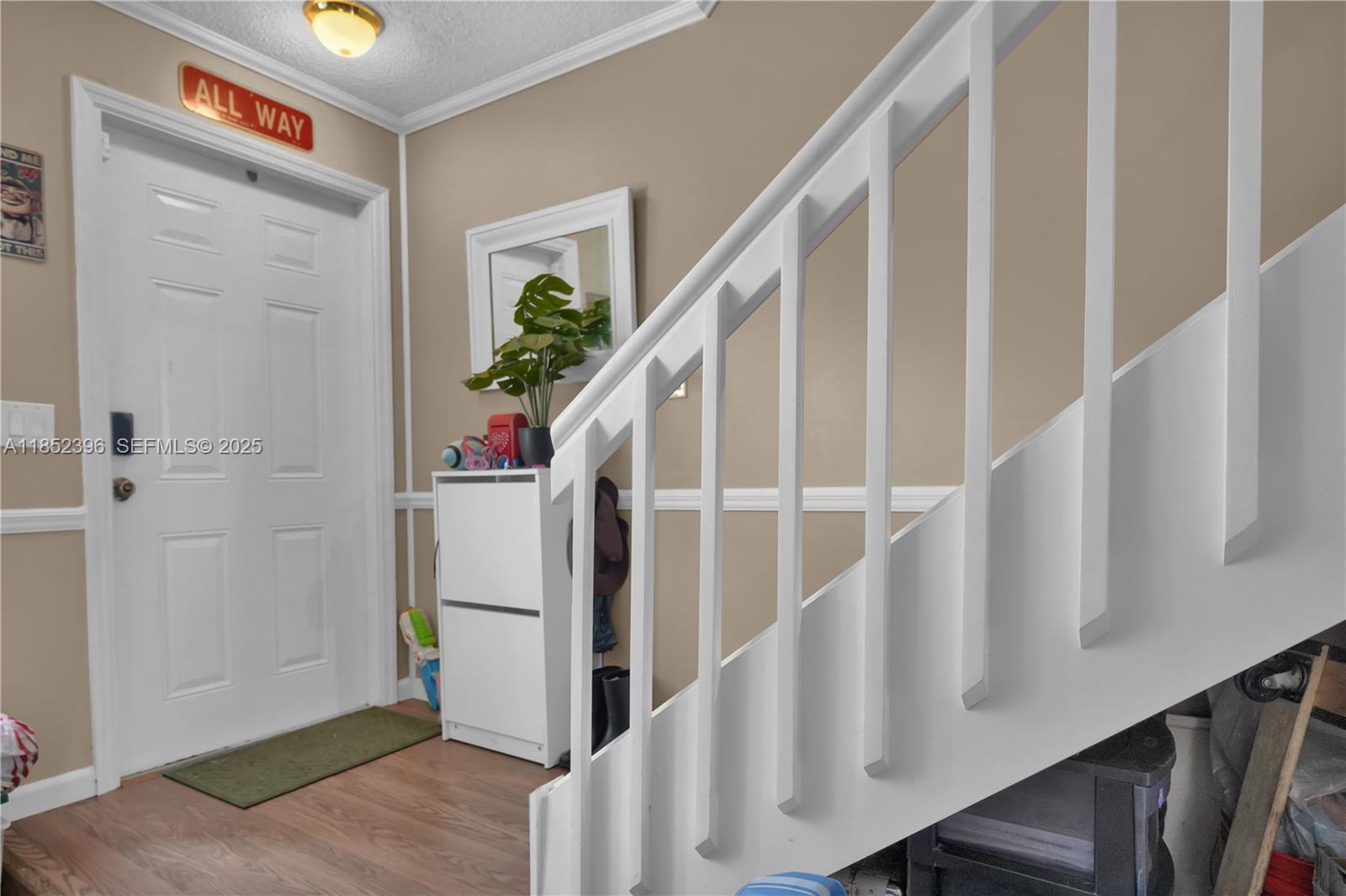 10194 Southwest 77th Court Miami, FL 33156 - Photo 8 of 25 a view of entryway with stairs
