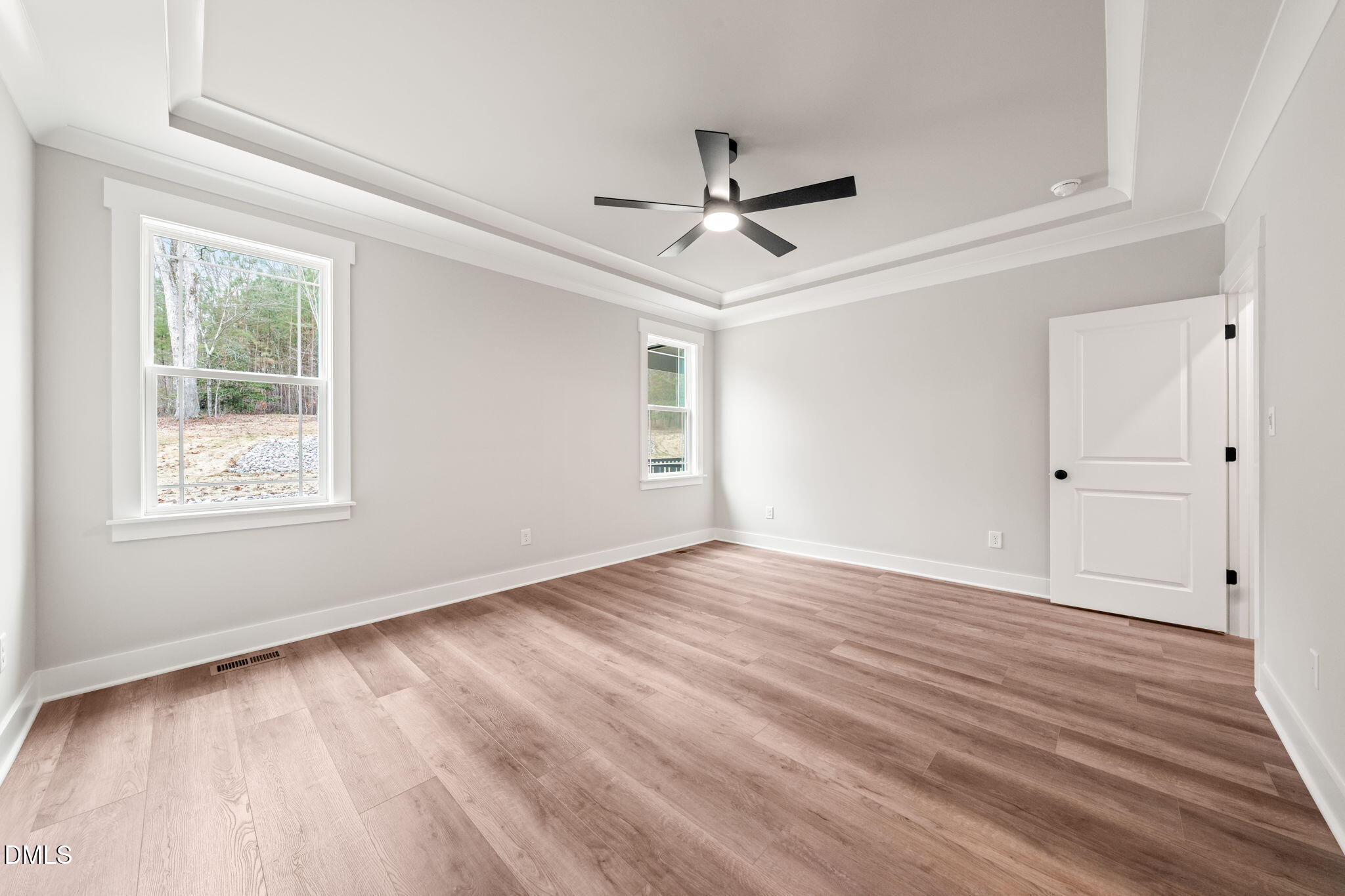 160 Pilot Ridge Road Zebulon, NC 27597 - Photo 22 of 49 a view of empty room with wooden floor and fan