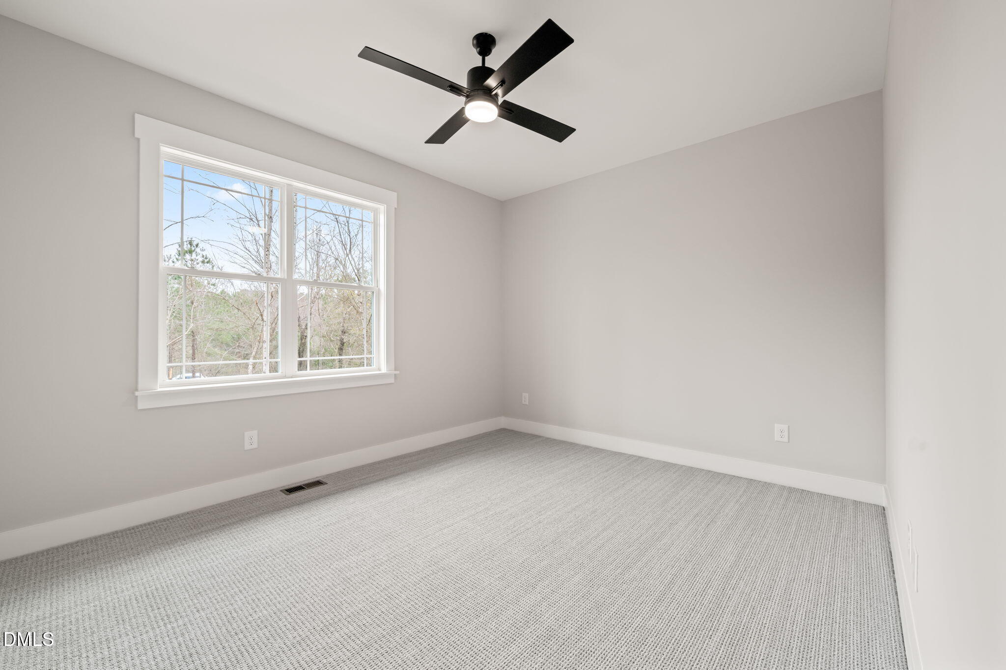 160 Pilot Ridge Road Zebulon, NC 27597 - Photo 29 of 49 an empty room with a window and a fan