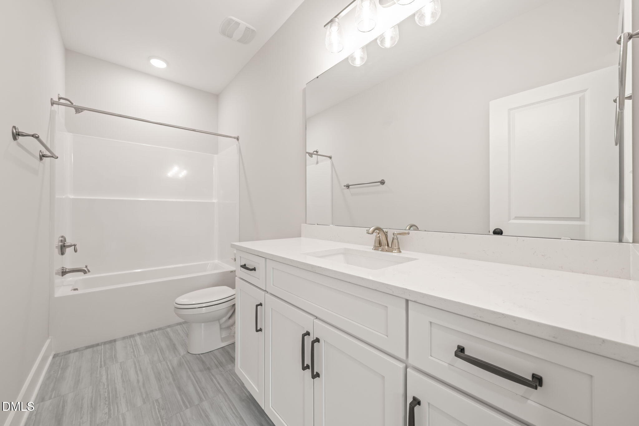 160 Pilot Ridge Road Zebulon, NC 27597 - Photo 30 of 49 a bathroom with a sink a toilet and bathtub