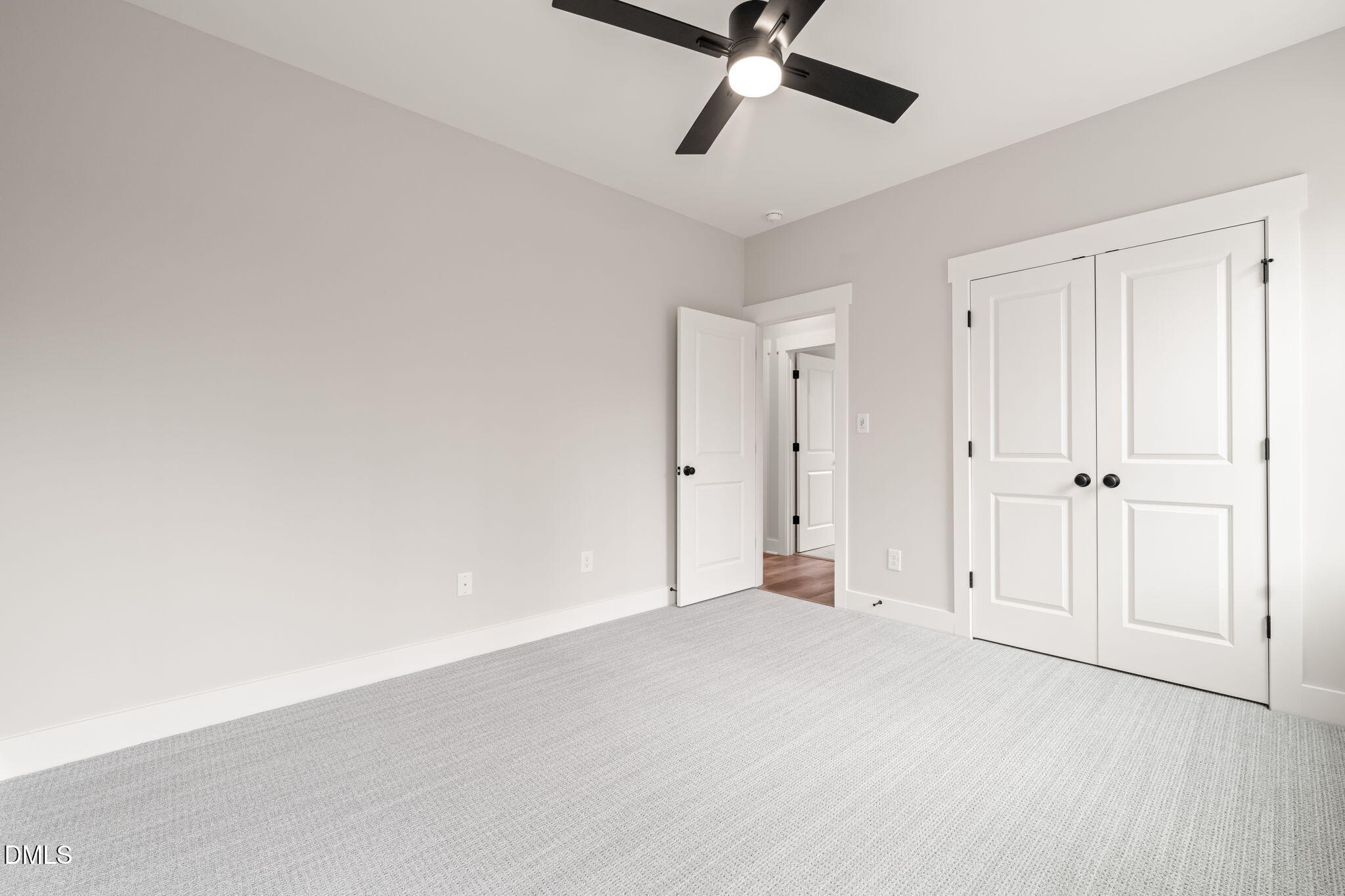 160 Pilot Ridge Road Zebulon, NC 27597 - Photo 32 of 49 an empty room with a ceiling fan and window
