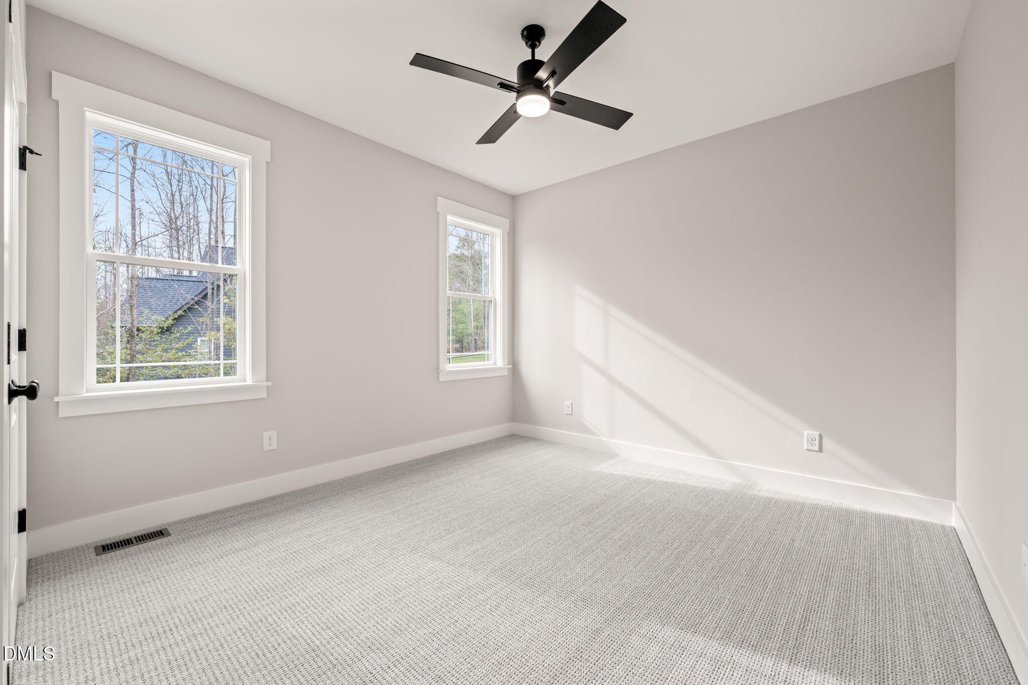 160 Pilot Ridge Road Zebulon, NC 27597 - Photo 34 of 49 an empty room with windows and fan