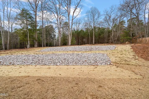 a view of a yard covered with snow