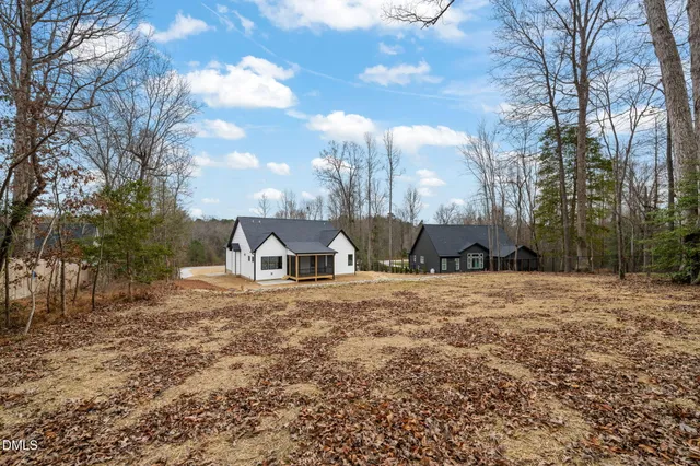 a big yard with large trees