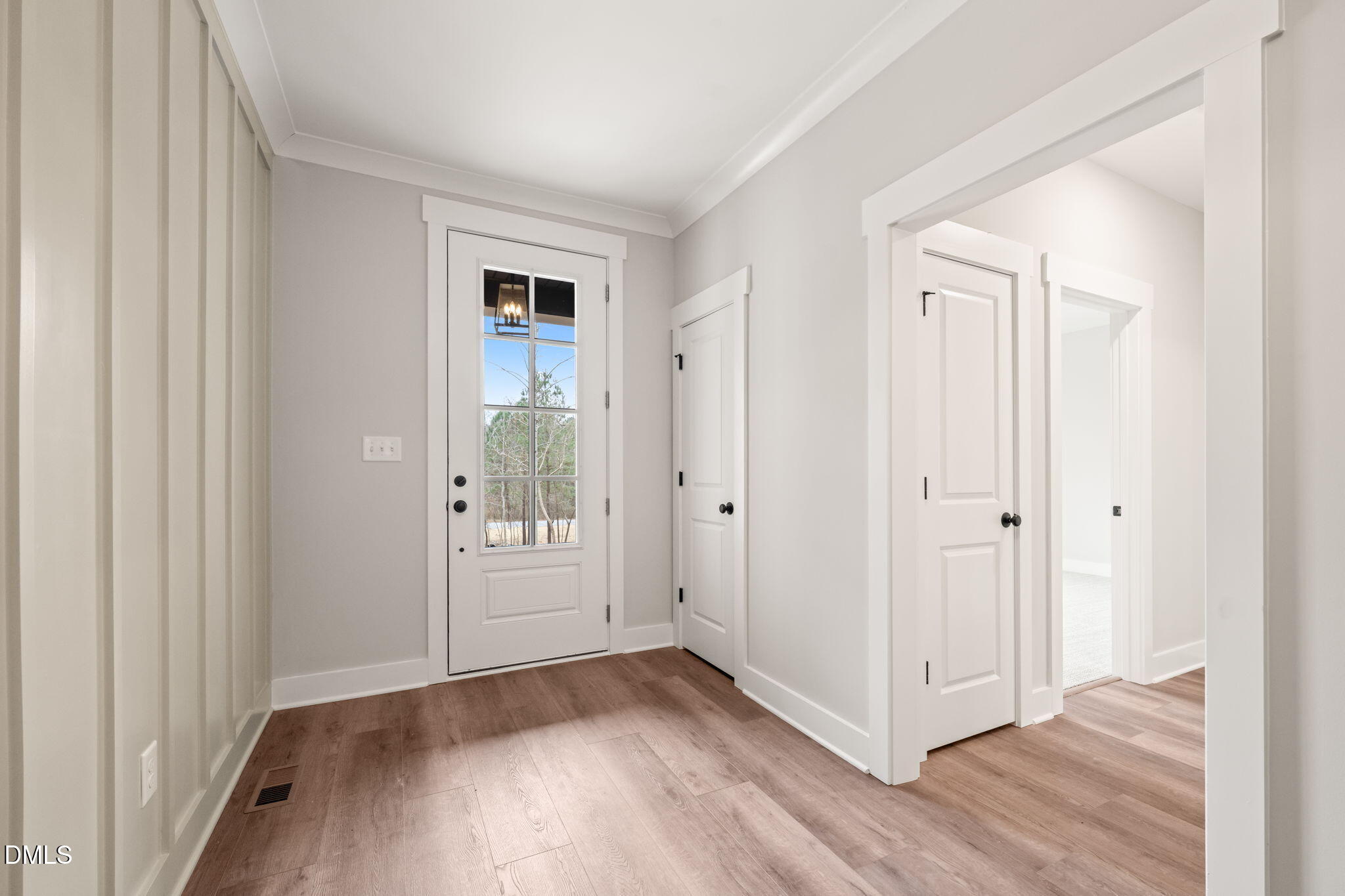 160 Pilot Ridge Road Zebulon, NC 27597 - Photo 5 of 49 an empty room with wooden floor and windows