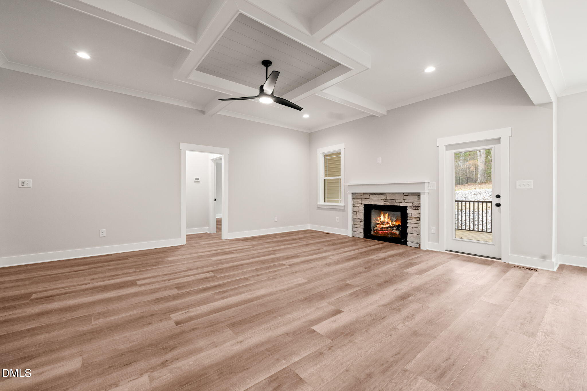 160 Pilot Ridge Road Zebulon, NC 27597 - Photo 9 of 49 a view of an empty room with wooden floor fireplace and a window