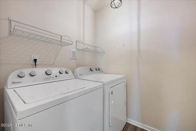 a utility room with dryer and washer