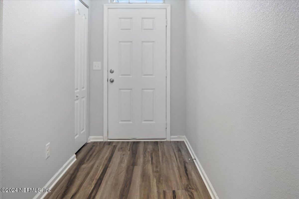65053 Lagoon Forest Drive Yulee, FL 32097 - Photo 3 of 19 a view of a room with wooden floor