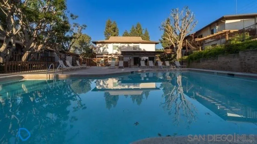 a view of a lake with a house in the background