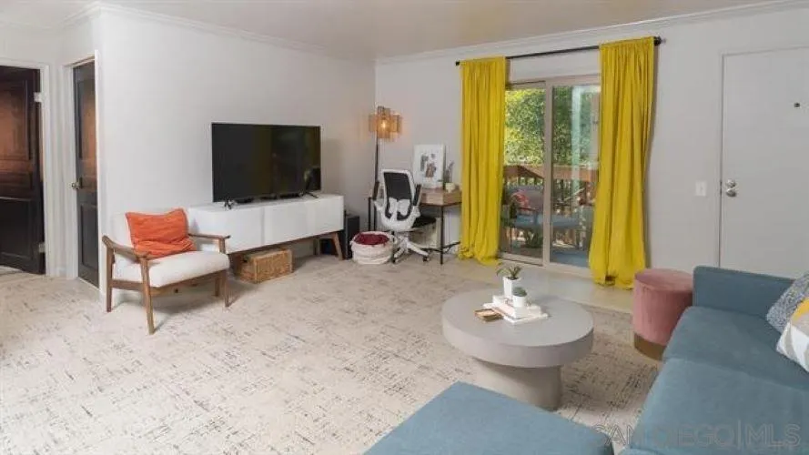 6358 Rancho Mission Road, Unit 624 San Diego, CA 92108 - Photo 5 of 16 a living room with furniture and a flat screen tv