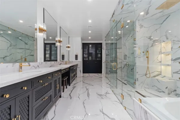 a spacious bathroom with a sink shower and a mirror