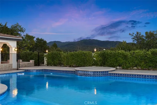 a view of a swimming pool with a yard